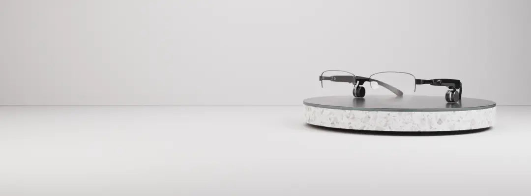 Unison Glasses on a clear stand against a white background